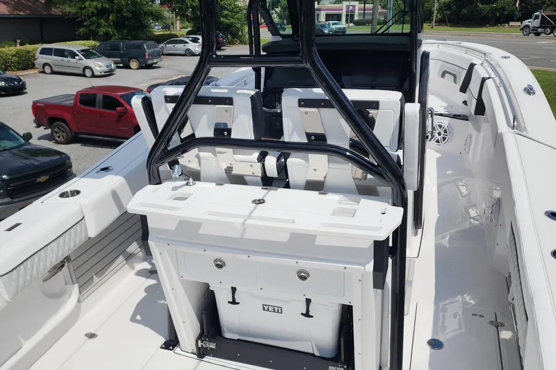 Slide: The Image of 2026 Blackfin 272 CC boat interior with seating and Yeti cooler. - 4