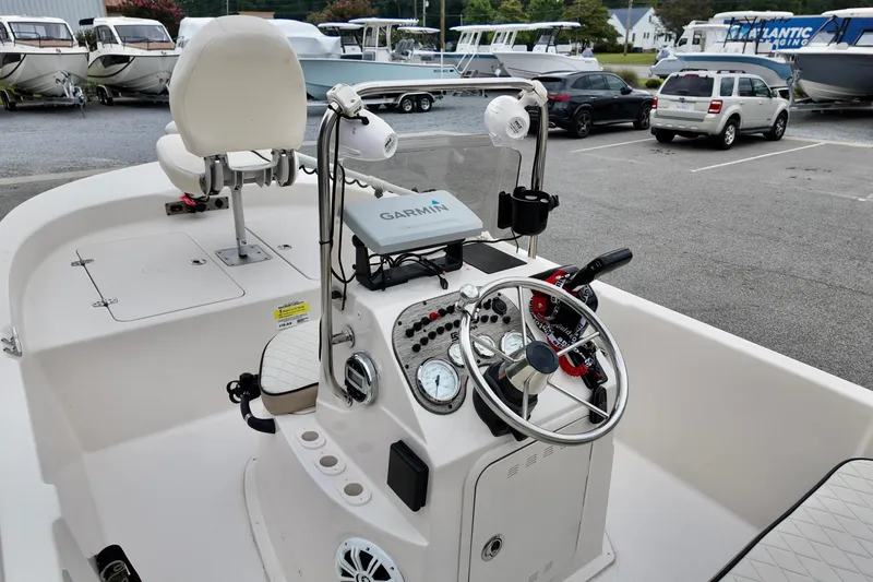 Slide: The Image of 2023 Carolina Skiff 178 boat interior with steering console and Garmin navigation system. - 8