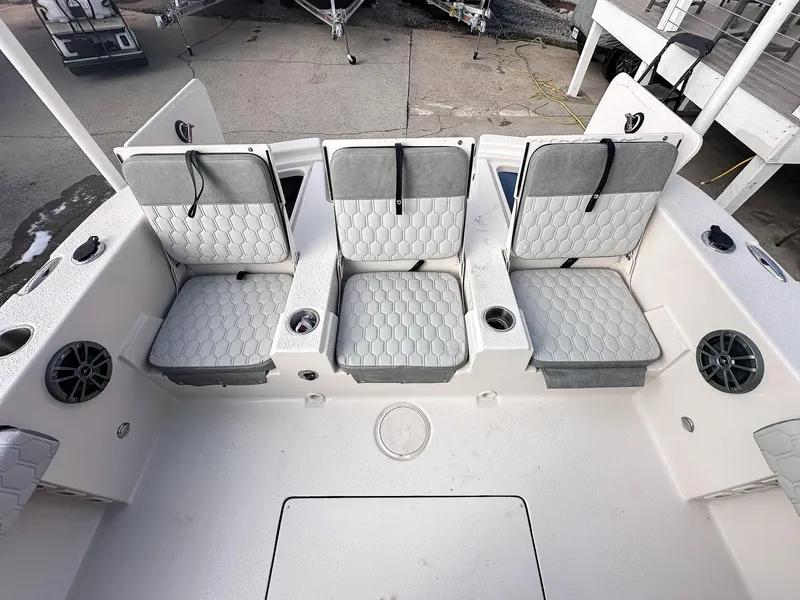 Slide: The Image of 2026 Carolina Skiff 22 Ultra Elite boat on trailer, parked outdoors. - 25