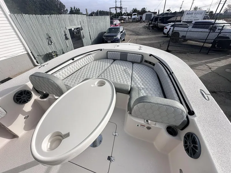 Slide: The Image of 2026 Carolina Skiff 22 Ultra Elite boat docked under clear blue sky. - 29