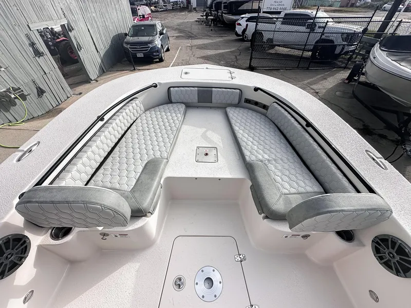 Slide: The Image of 2026 Carolina Skiff 22 Ultra Elite boat interior with three cushioned seats and cup holders. - 31