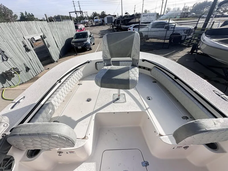 Slide: The Image of 2026 Carolina Skiff 22 Ultra Elite boat at a marina, showcasing seating and deck layout. - 35