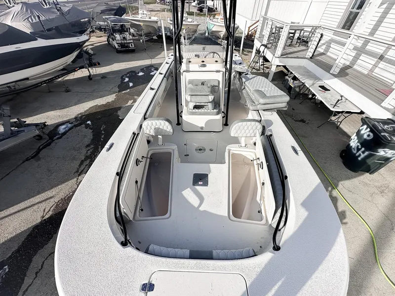 Slide: The Image of 2026 Carolina Skiff 22 Ultra Elite boat interior with seating and storage compartments. - 37