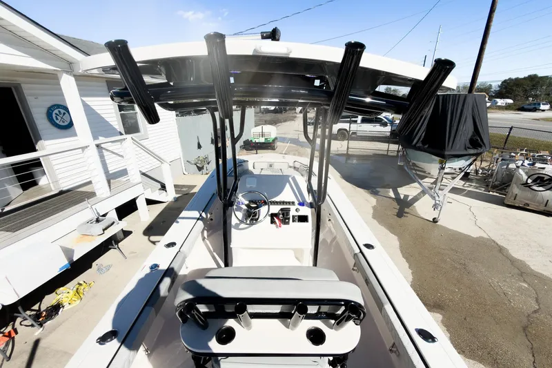 Slide: The Image of 2026 Carolina Skiff 22 Ultra Elite boat, docked, showcasing helm and seating area. - 46