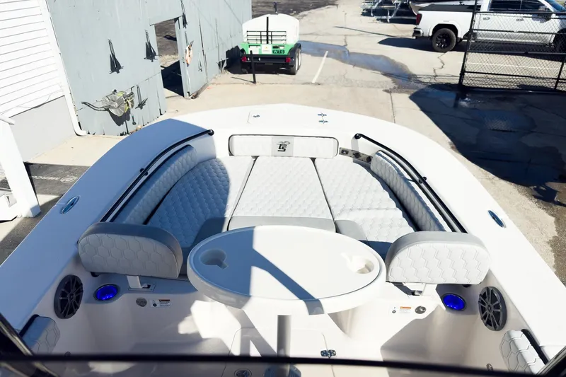 Slide: The Image of 2026 Carolina Skiff 22 Ultra Elite boat interior with cushioned seating and table. - 56