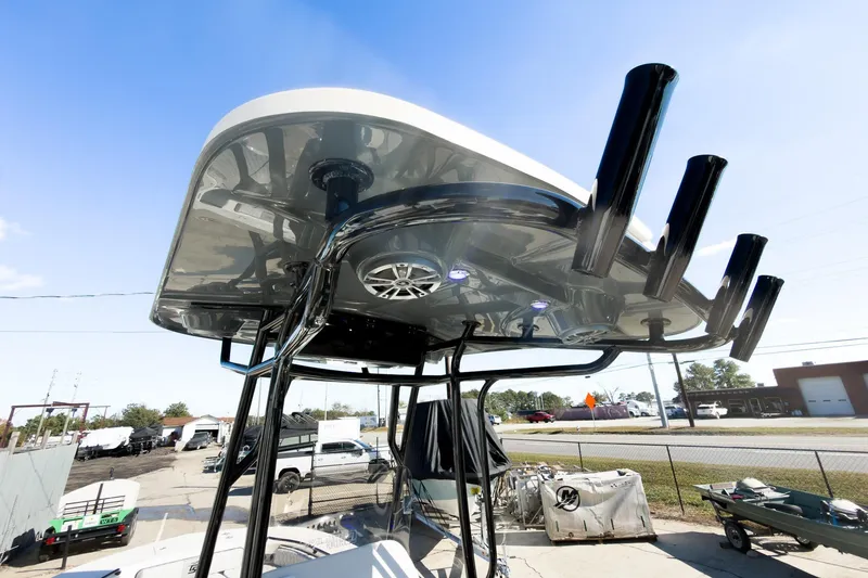 Slide: The Image of 2026 Carolina Skiff 22 Ultra Elite boat with T-top and rod holders. - 58