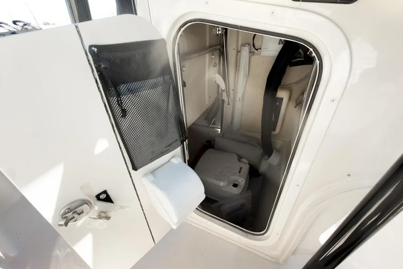 Slide: The Image of Interior storage compartment of 2026 Carolina Skiff 22 Ultra Elite boat. - 59