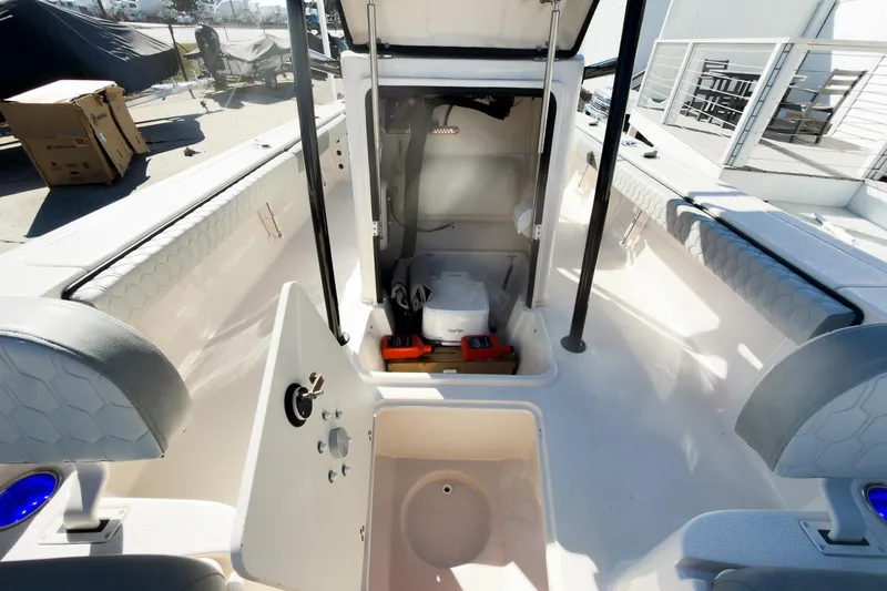 Slide: The Image of 2026 Carolina Skiff 22 Ultra Elite boat interior with storage compartments and seating. - 63