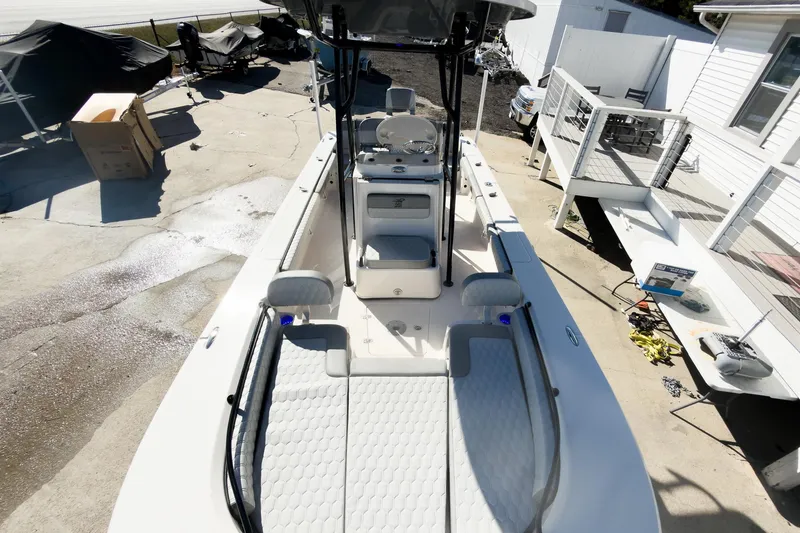 Slide: The Image of 2026 Carolina Skiff 22 Ultra Elite boat, top view, docked near a house. - 65