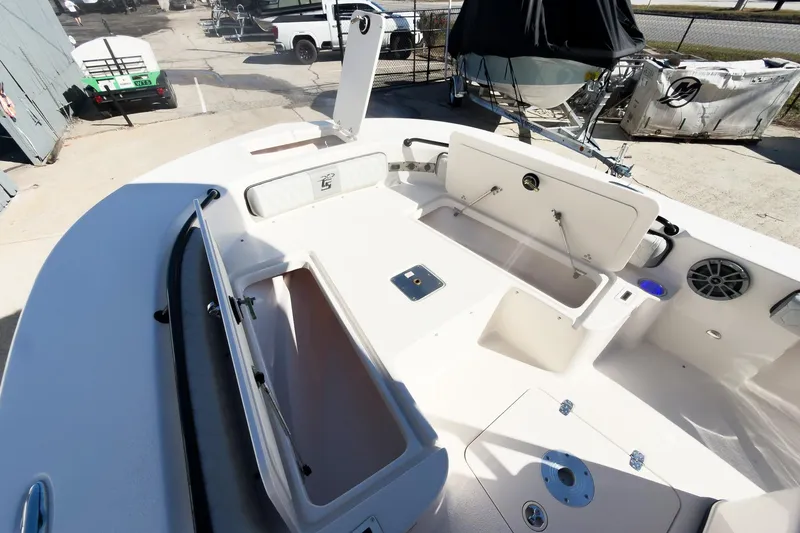 Slide: The Image of 2026 Carolina Skiff 22 Ultra Elite boat interior with open storage compartments and seating. - 69