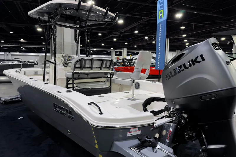 Slide: The Image of 2026 Carolina Skiff 22 Ultra Elite boat with Suzuki engine at indoor exhibition. - 73