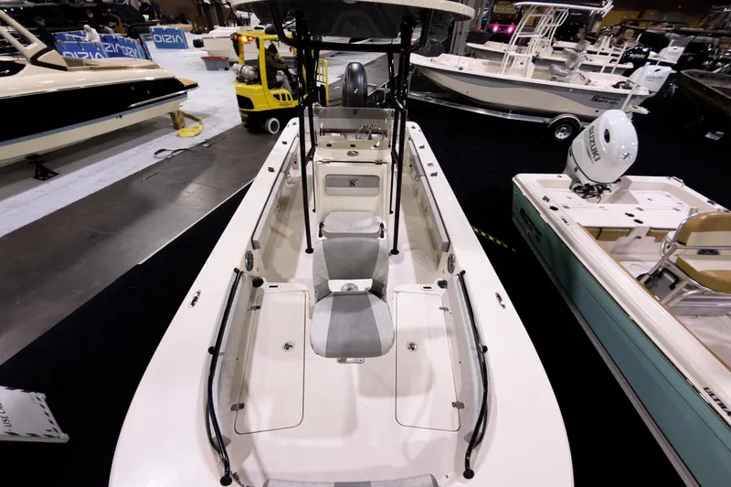Slide: The Image of 2026 Carolina Skiff 22 Ultra Elite boat displayed at a boat show. - 76