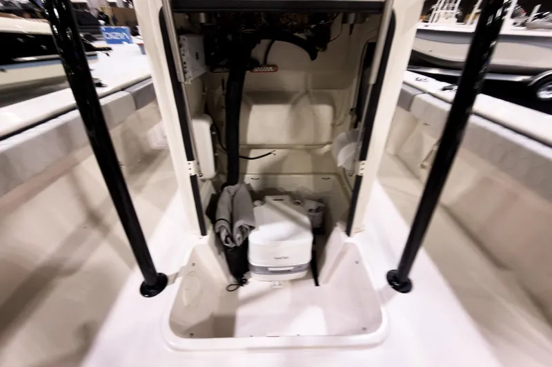 Slide: The Image of 2026 Carolina Skiff 22 Ultra Elite interior storage compartment with equipment and accessories. - 80