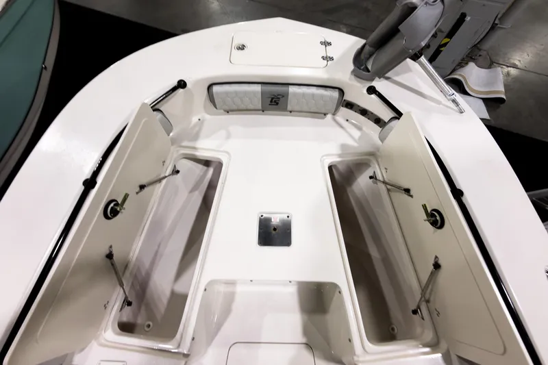 Slide: The Image of 2026 Carolina Skiff 22 Ultra Elite boat interior with open storage compartments. - 83