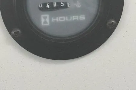 Slide: The Image of Hour meter on 2007 Cobalt 302 boat dashboard, displaying 405 hours. - 18