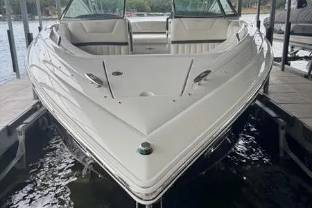 Slide: The Image of 2007 Cobalt 302 boat docked, showcasing sleek design and spacious seating. - 19