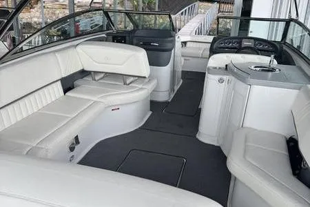 Slide: The Image of 2007 Cobalt 302 boat interior with white leather seating and modern dashboard. - 21