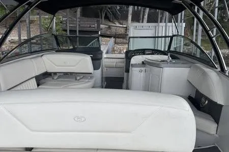 Slide: The Image of 2007 Cobalt 302 boat interior with white seating and sleek design. - 22