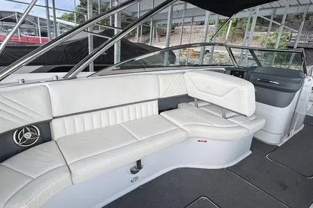 Slide: The Image of 2007 Cobalt 302 boat interior with white leather seating and modern design. - 23