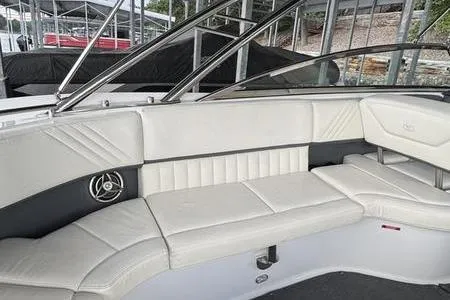 Slide: The Image of 2007 Cobalt 302 boat interior with white leather seating and sleek design. - 25