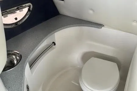 Slide: The Image of 2007 Cobalt 302 boat interior bathroom with sink and toilet. - 30