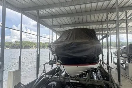 Slide: The Image of 2007 Cobalt 302 boat covered in dock, scenic lake view. - 37