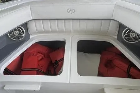 Slide: The Image of 2007 Cobalt 302 boat interior with storage compartments and life jackets. - 40