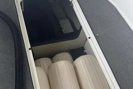 Slide: The Image of Storage compartment in a 2007 Cobalt 302 boat with cylindrical fenders. - 41