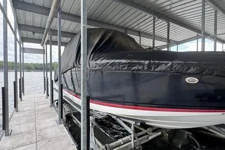 Slide: The Image of 2007 Cobalt 302 boat covered and docked in a sheltered marina. - 43