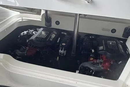 Slide: The Image of 2007 Cobalt 302 boat engine compartment with dual engines visible. - 8