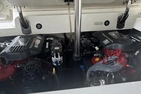 Slide: The Image of 2007 Cobalt 302 boat engine compartment with dual engines and mechanical components. - 9