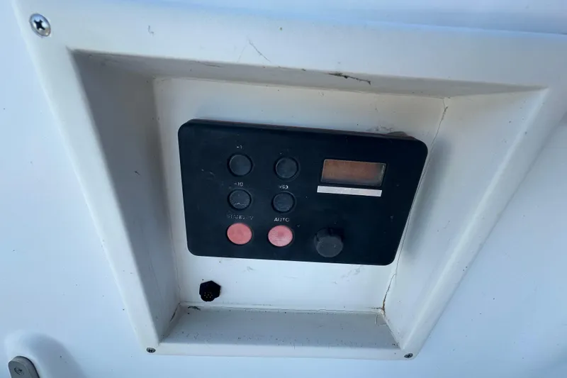 Slide: The Image of Control panel on a 1989 Nonsuch 36 sailboat, featuring buttons and a display. - 15