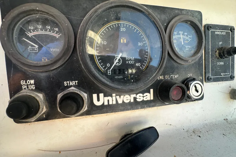 Slide: The Image of Control panel of a 1989 Nonsuch 36 sailboat with Universal engine gauges. - 16