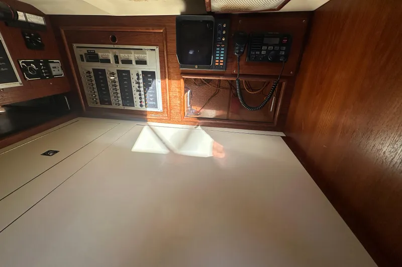 Slide: The Image of Control panel and radio equipment inside a 1989 Nonsuch 36 sailboat cabin. - 38
