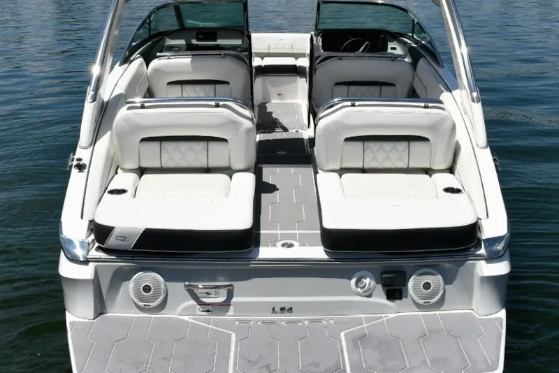 Slide: The Image of 2019 Regal LS4 boat with luxurious seating and modern design on calm water. - 4