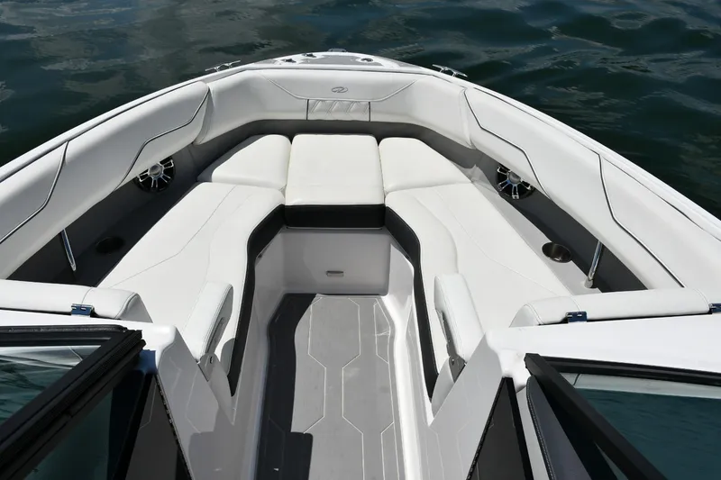 Slide: The Image of 2019 Regal LS4 boat interior with white seating and sleek design on water. - 5