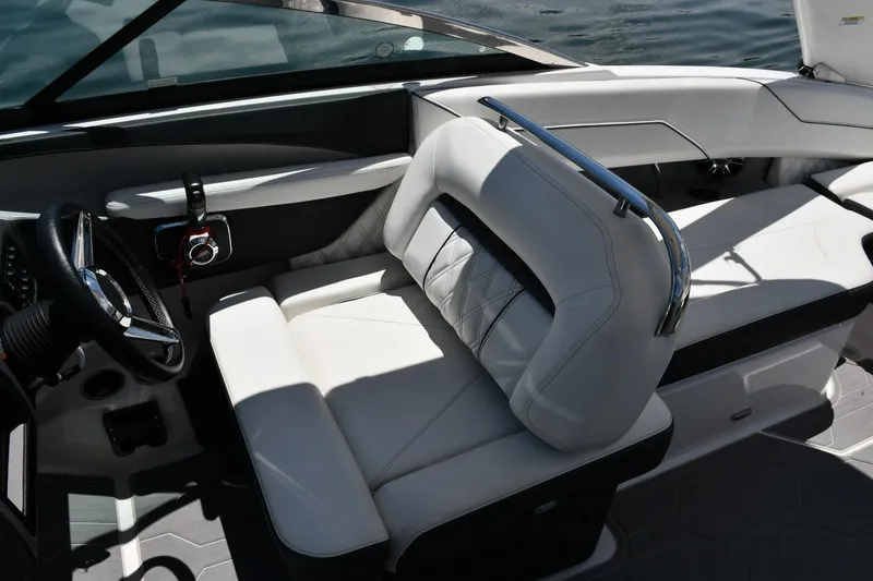 Slide: The Image of 2019 Regal LS4 boat interior with white leather seating and steering wheel. - 6