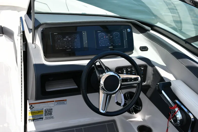 Slide: The Image of 2019 Regal LS4 boat dashboard with steering wheel and digital displays. - 7