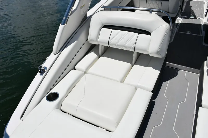 Slide: The Image of 2019 Regal LS4 boat with luxurious white seating and sleek design on the water. - 9