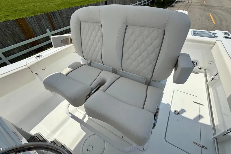 Slide: The Image of Luxury seating on 2026 Sea Hunt Gamefish 27 Coffin Box boat, featuring quilted upholstery. - 10