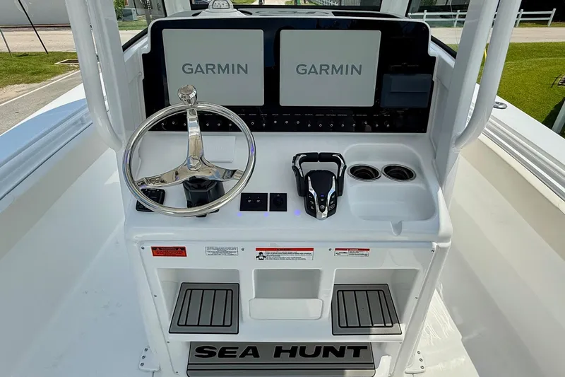 Slide: The Image of 2026 Sea Hunt Gamefish 27 Coffin Box helm with dual Garmin displays and steering wheel. - 11