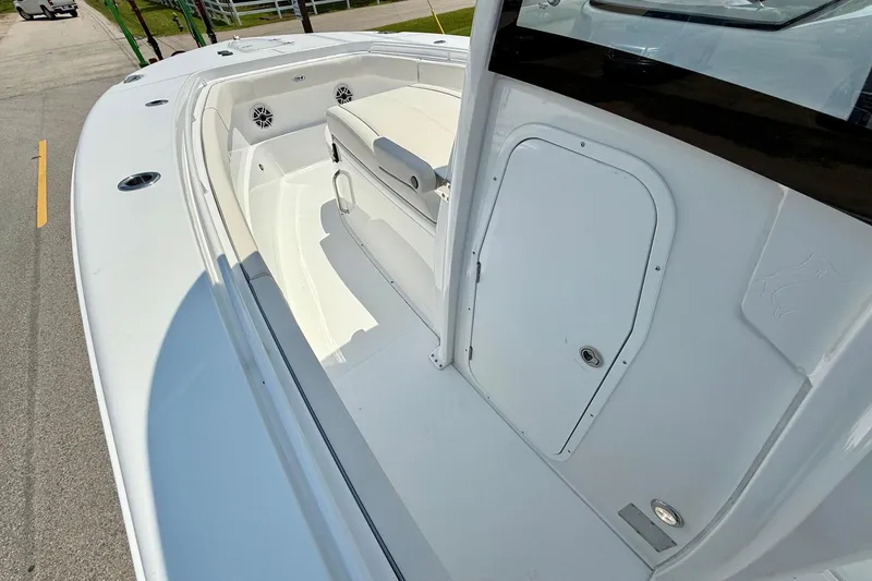 Slide: The Image of 2026 Sea Hunt Gamefish 27 Coffin Box boat interior, featuring spacious seating and storage. - 13