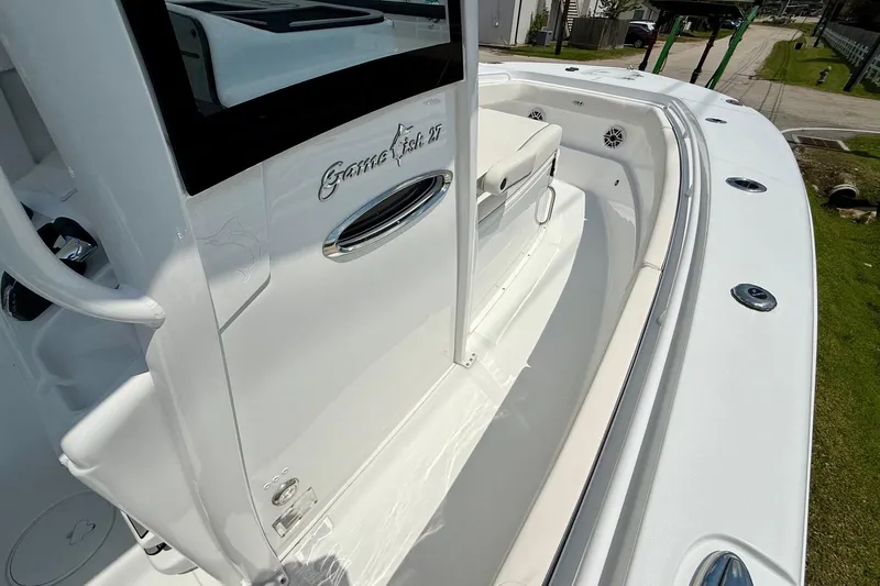 Slide: The Image of 2026 Sea Hunt Gamefish 27 Coffin Box boat interior, showcasing sleek design and seating. - 16