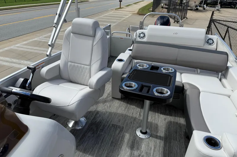 Slide: The Image of 2022 Avalon Catalina VRL 25' boat interior with plush seating and cup holders. - 17