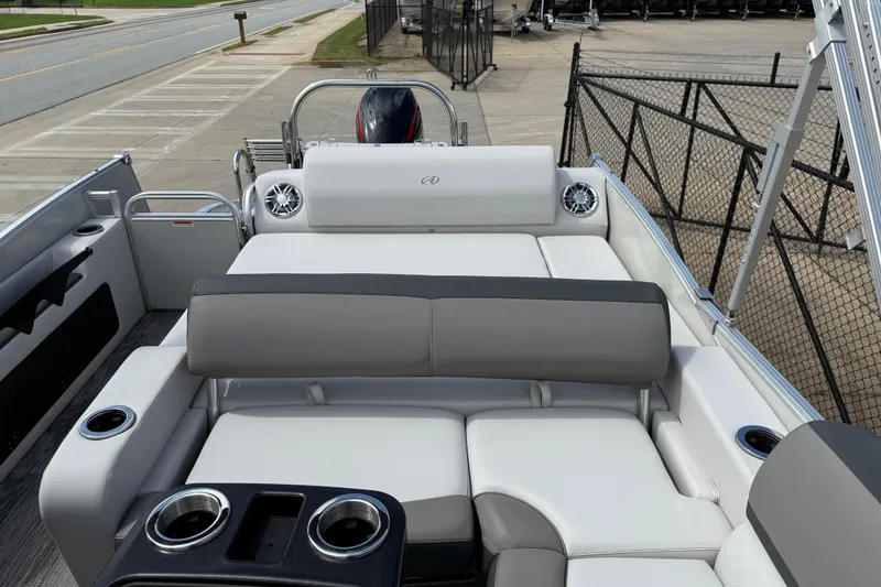 Slide: The Image of 2022 Avalon Catalina VRL 25' boat interior with plush seating and cup holders. - 18