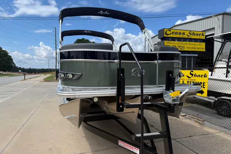 Slide: The Image of 2022 Avalon Catalina VRL 25' pontoon boat on trailer at dealership. - 2