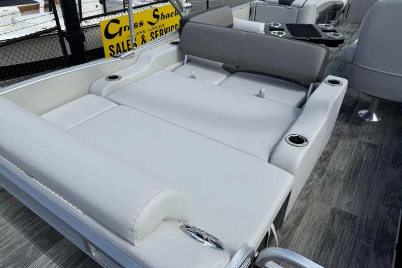 Slide: The Image of 2022 Avalon Catalina VRL 25' boat interior with luxurious seating and cup holders. - 32