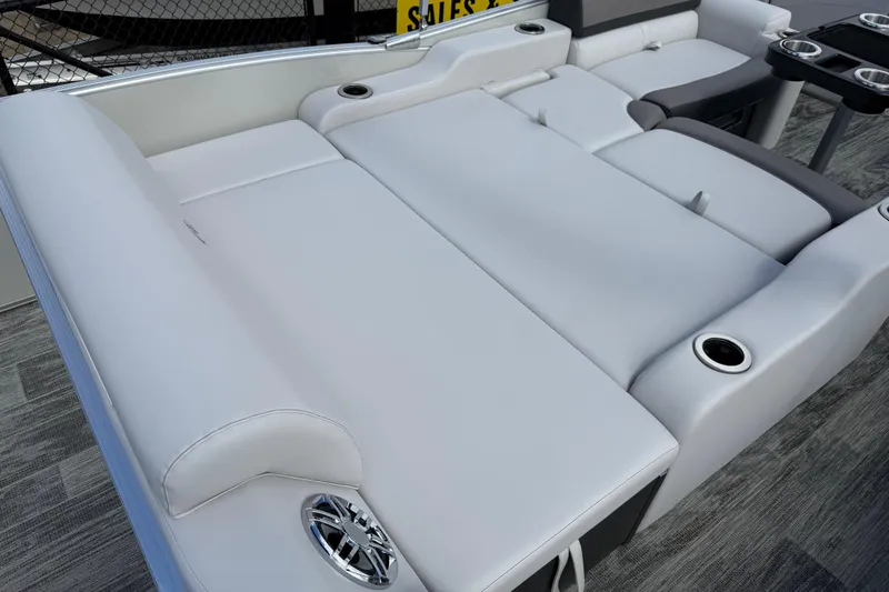 Slide: The Image of 2022 Avalon Catalina VRL 25' boat interior with luxurious white seating and cup holders. - 33