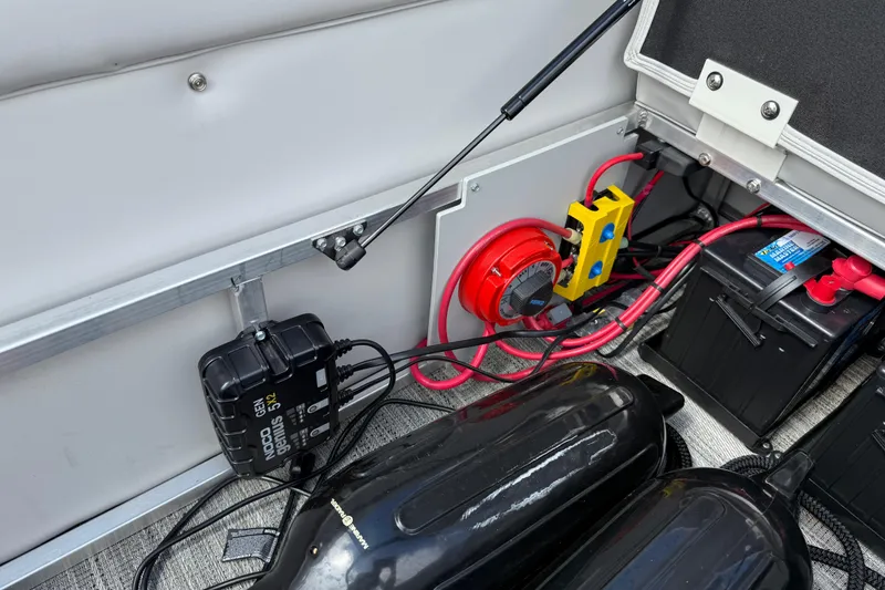 Slide: The Image of 2022 Avalon Catalina VRL - 25' boat battery compartment with wiring and components. - 35