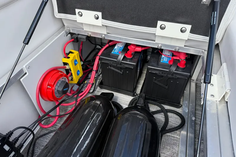 Slide: The Image of 2022 Avalon Catalina VRL boat battery compartment with dual batteries and wiring. - 36